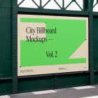Big horizontal city billboard mockup with a green, beige design attached to the dark green metallic wall elevation.