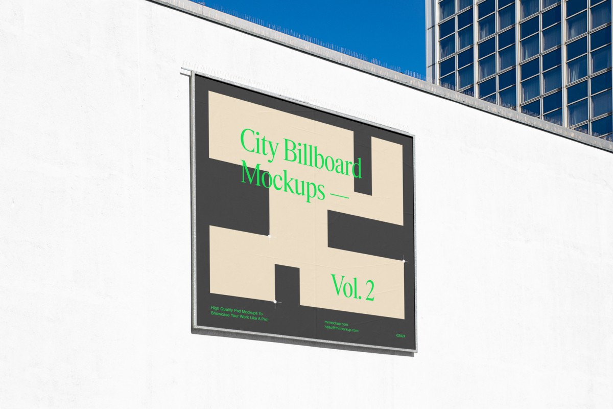 Square city billboard mockup with a dark gray, green design and silver metal frames attached to the white wall facade.