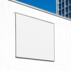 White square city billboard mockup with a dark silver metal frames attached to the white wall facade.