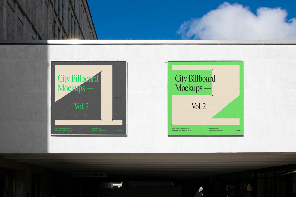 Front view, two square city billboard mockups with a dark gray, green design attached to the white wall facade.
