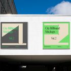 Front view, two square city billboard mockups with a dark gray, green design attached to the white wall facade.
