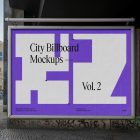 Front view, city billboard mockup with a white, purple design and silver frames attached to the wall in the middle of the city.