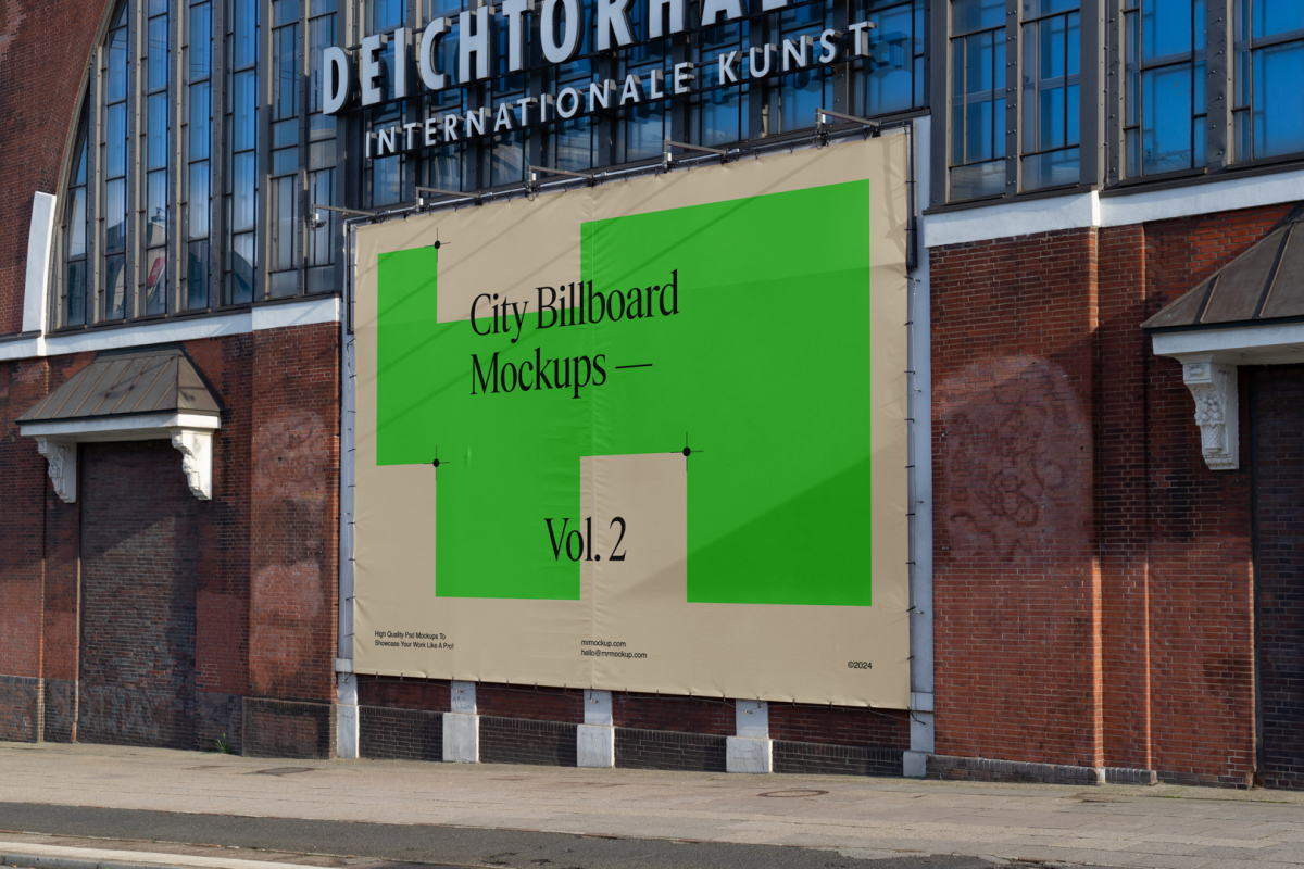 Big horizontal city billboard mockup with green, beige design attached to the brick wall elevation.
