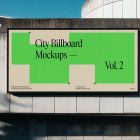 Front view, horizontal city billboard mockup with bright beige, green design and black frames attached to the concrete building facade.