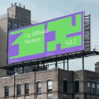 City billboard mockup attached to the roof of the building, with the clean blue sky in the background.