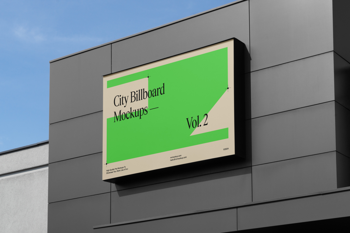 Horizontal city billboard mockup with bright beige, green design and black frames attached to the metal gray building facade.