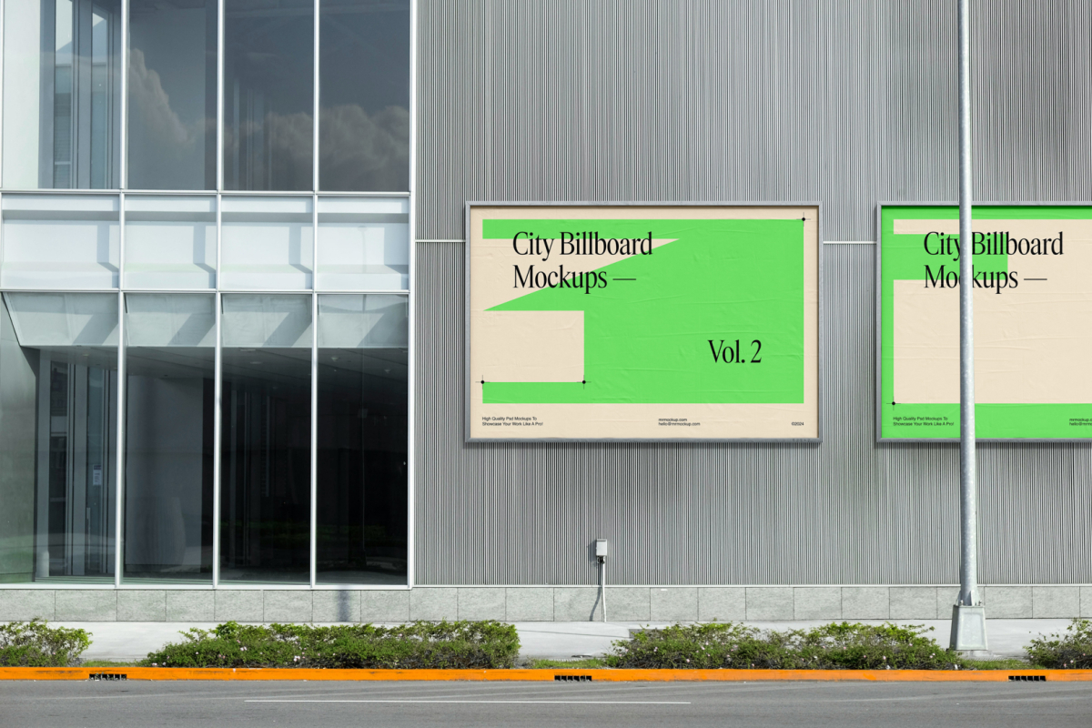 Front view, two horizontal city billboard mockups with bright beige, green design and silver frames attached to the gray building elevation.