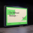 Horizontal city billboard mockup with a green, beige design attached to the black marble wall.