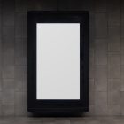 Front view, vertical white city billboard mockup attached to the dark gray wall.