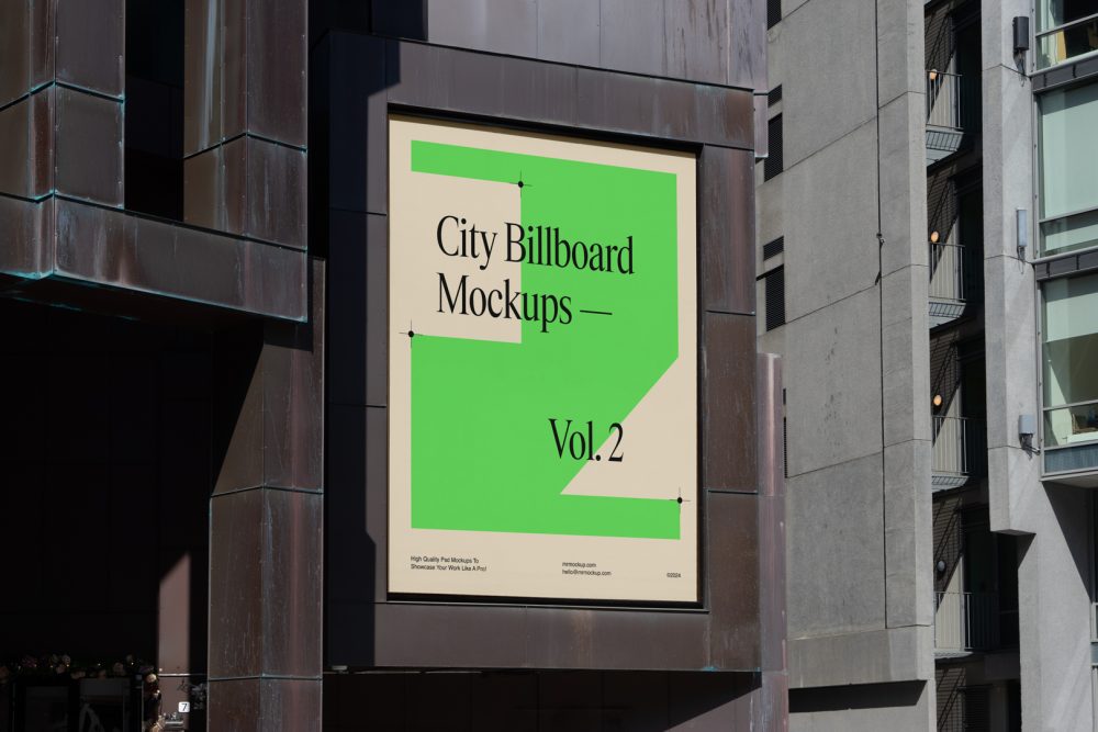 Big vertical city billboard mockup with bright beige, green design attached to the building elevation.