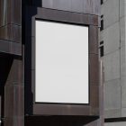 A big white vertical city billboard mockup attached to the building elevation.