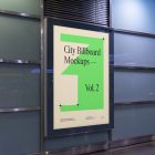 Vertical city billboard mockup with bright beige design attached to the wall.