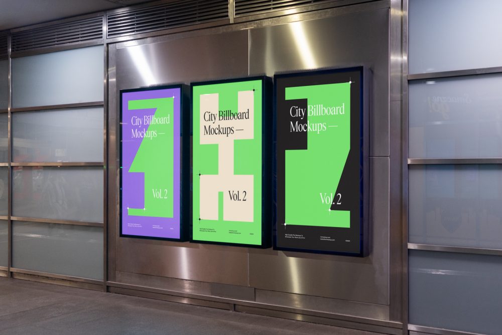 Three vertical city billboard mockups with green, purple, and black design with black frames attached to the silver metallic wall.