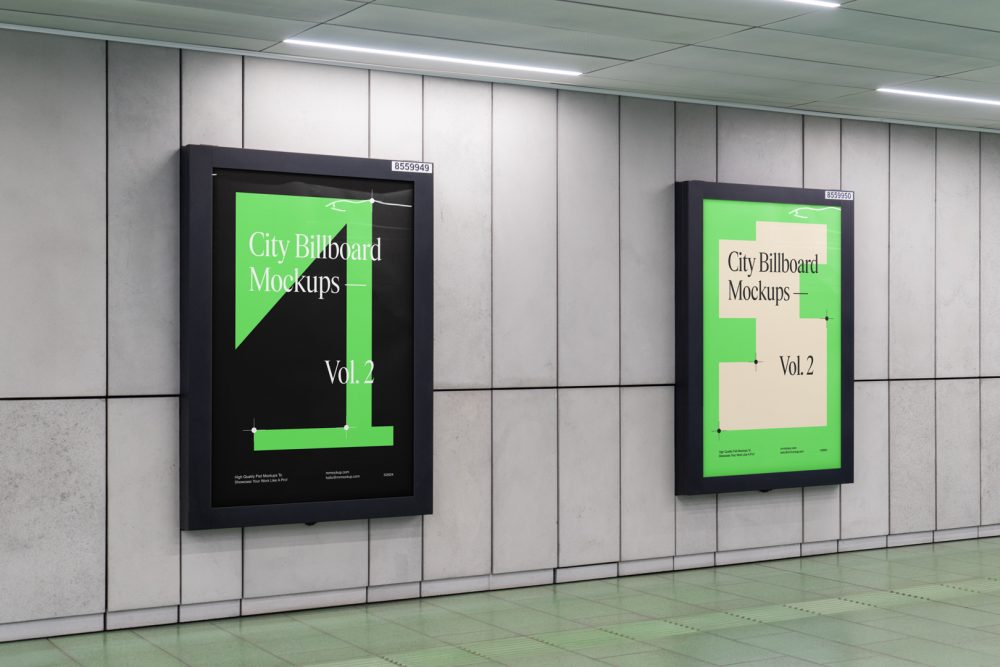 Two vertical city billboard mockups with green and black design and black strong frames attached to the gray wall.