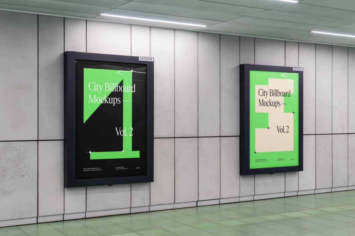 Two vertical city billboard mockups with green and black design and black strong frames attached to the gray wall.