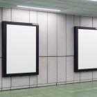 Two white vertical city billboard mockups with black strong frames attached to the gray wall.