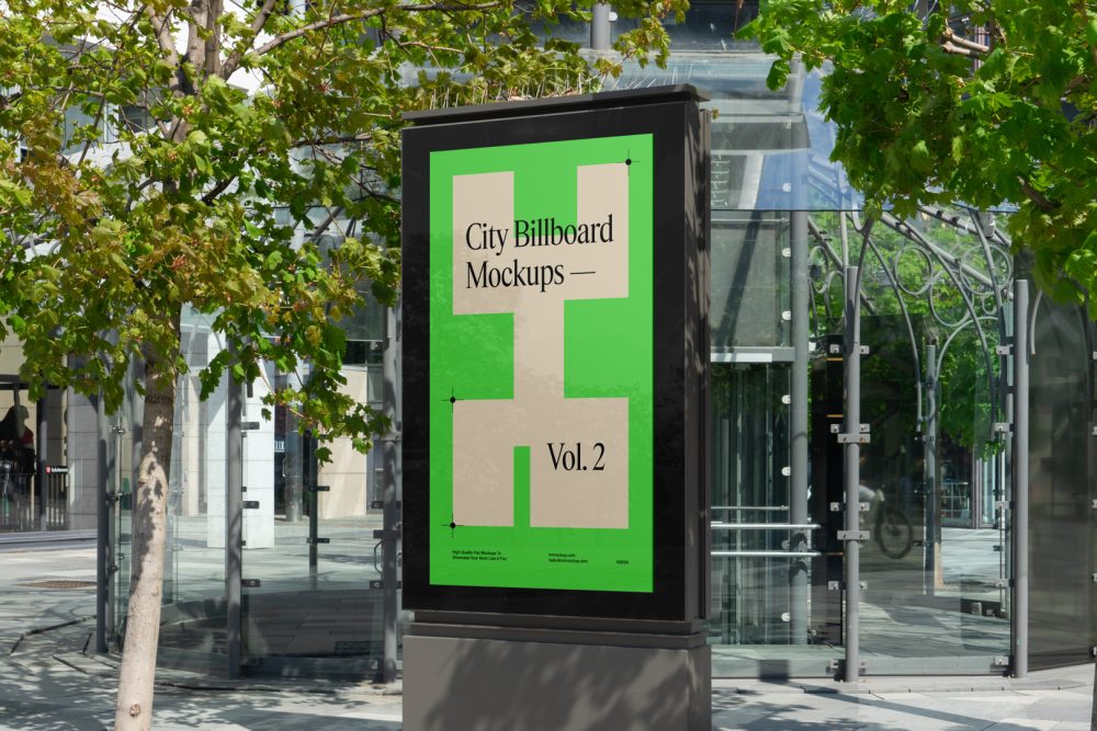 City light billboard mockup standing pedestal between the buildings in the middle of the city in the background.