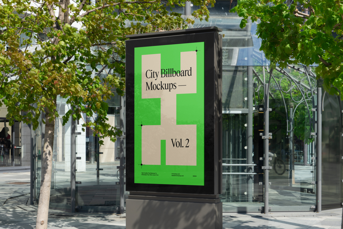 City light billboard mockup standing pedestal between the buildings in the middle of the city in the background.