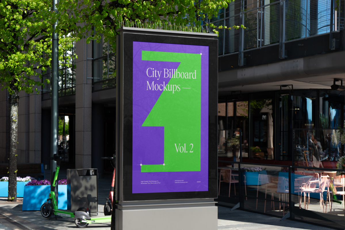 City light billboard mockup standing pedestal between the buildings in the middle of the city in the background.