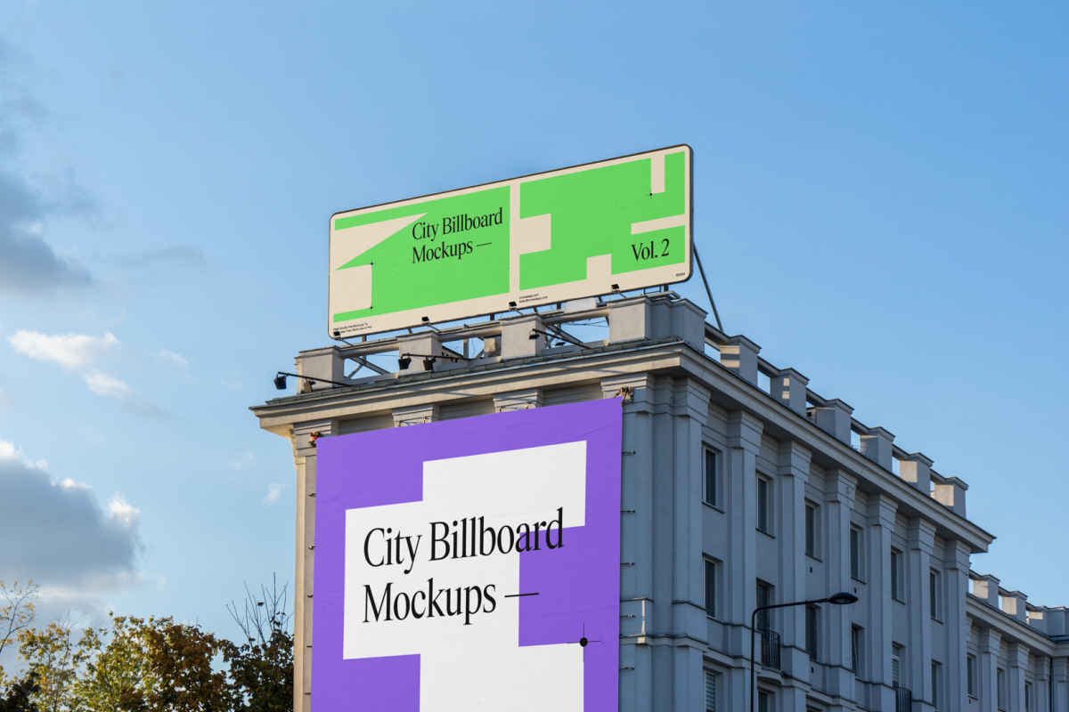 Front view, two city billboard mockups attached to the building elevation, with the clean blue sky in the background.