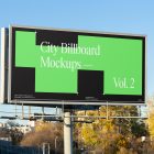 Front view, city billboard mockup with silver frames and black, green to white graphics.