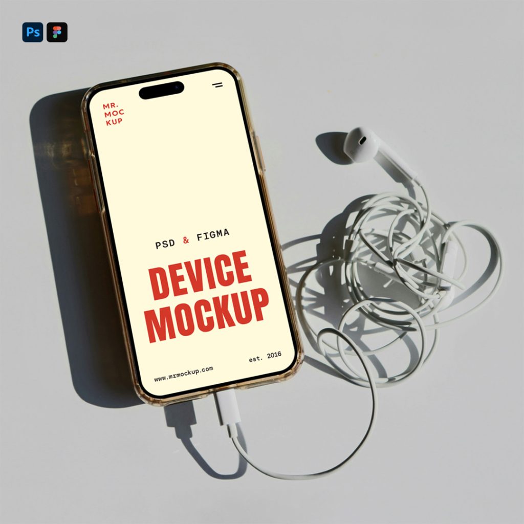 View from above, iPhone Pro Mockup with headphones attached laying on the gray floor.