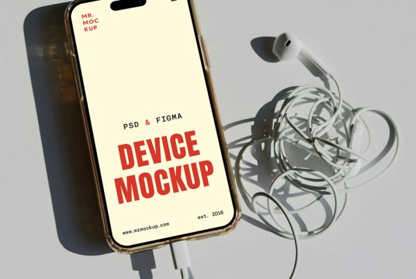 View from above, iPhone Pro Mockup with headphones attached laying on the gray floor.