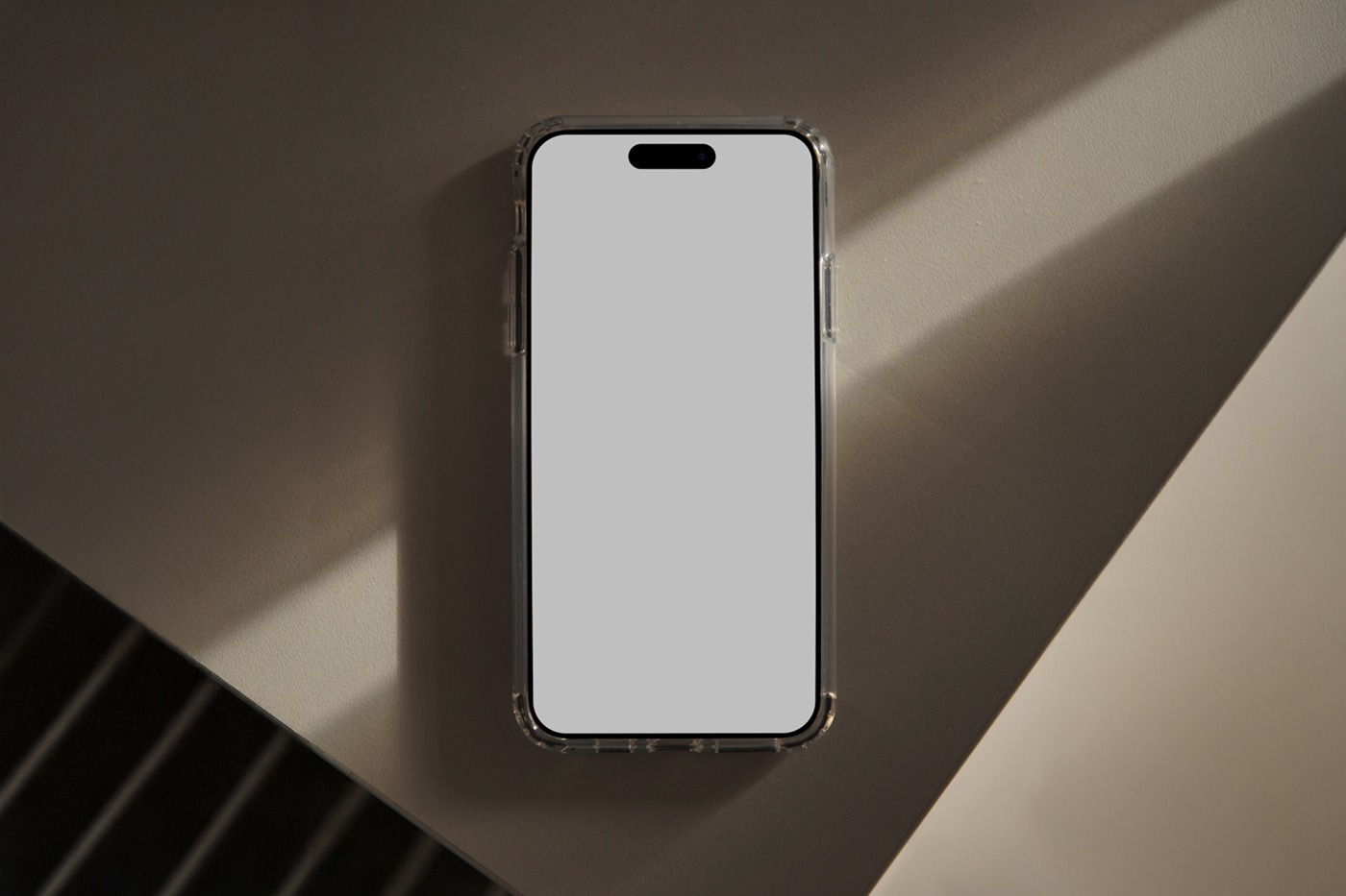View from above, iPhone 16 Pro Mockup with white screen laying on the beige table.