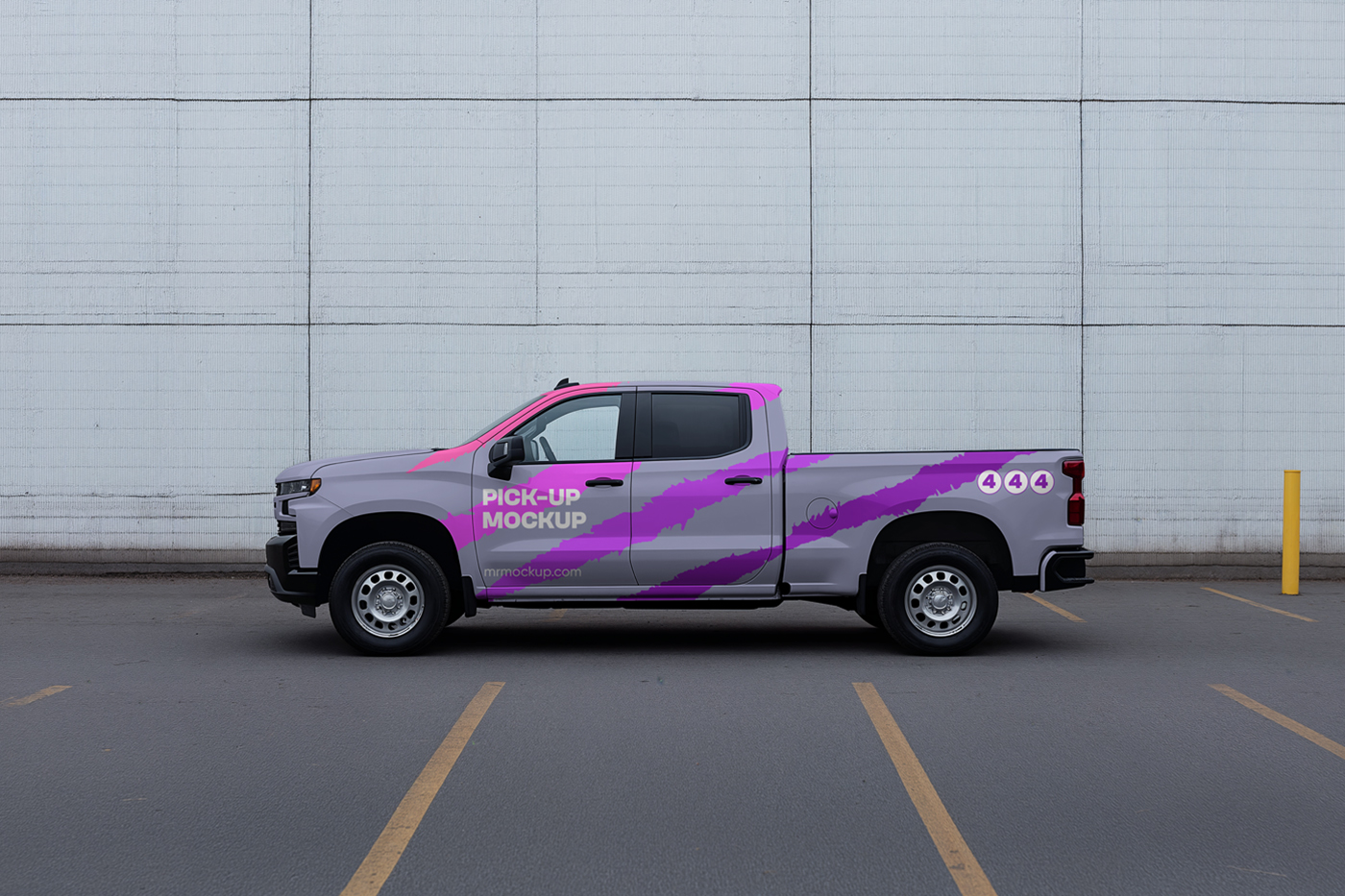 Front view, pickup truck mockup standing on the parking in front of the bright blue wall.