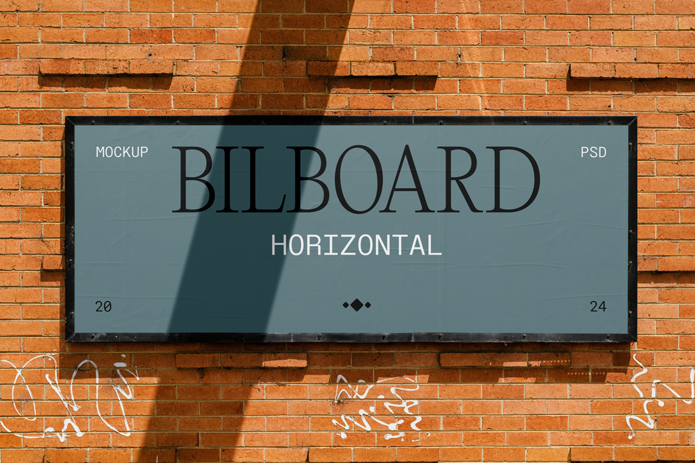 Front view, horizontal billboard with a black frame attached to the brick wall.