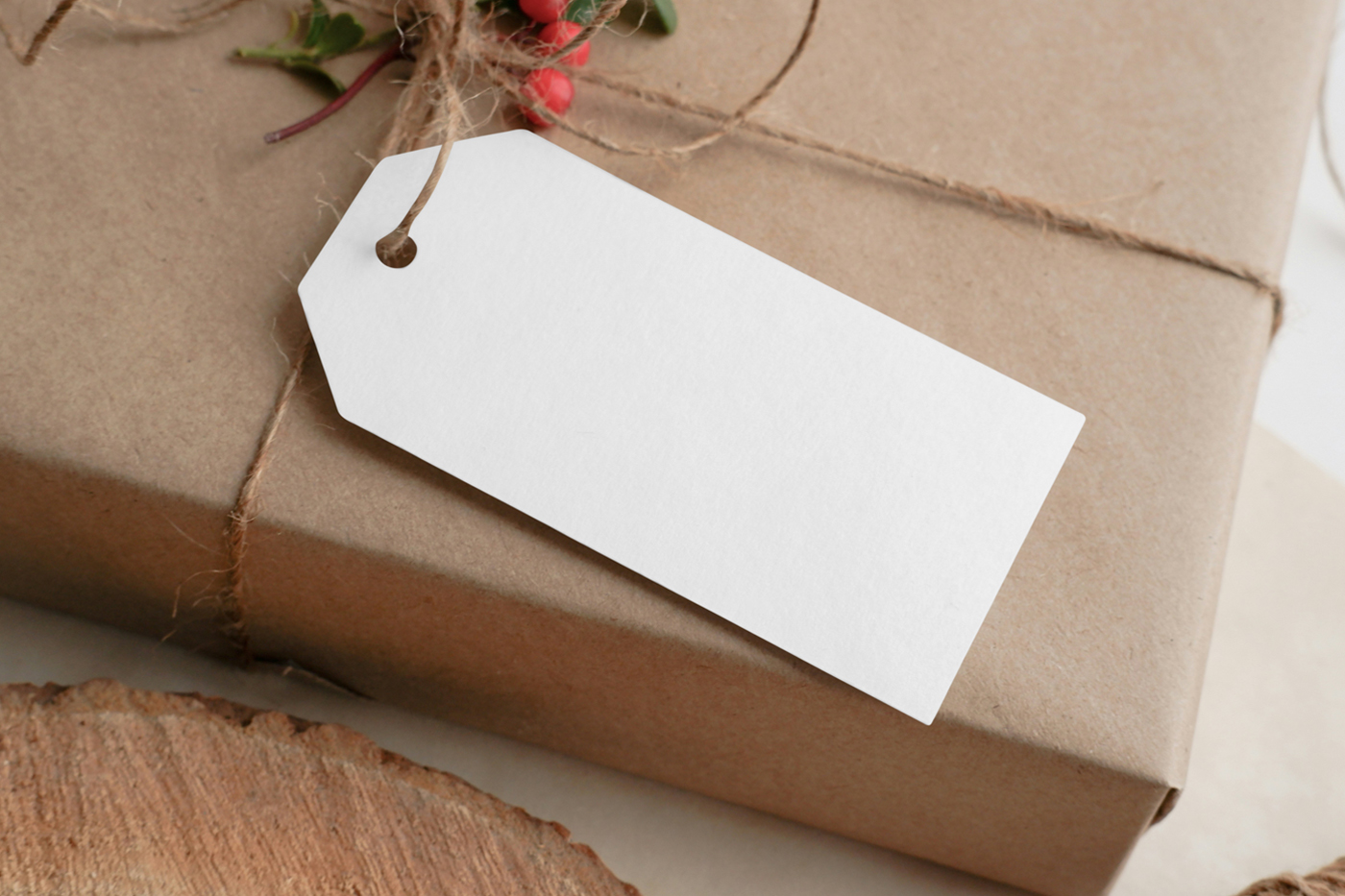 View from above, white label mockup attached to craft package gift box.