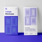 Front view, two standing on purple floor, Trifold Mockups based on white wall.