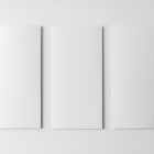 View from above, three white Trifold Mockups laying on a white floor.