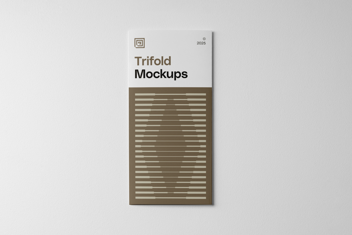 View from above, laying single Trifold Mockups on white floor.