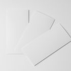 View from above, three white Trifold Mockups laying on the white floor.
