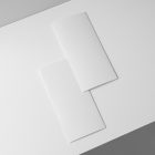 View from above, two white Trifold Mockups laying on the white box.