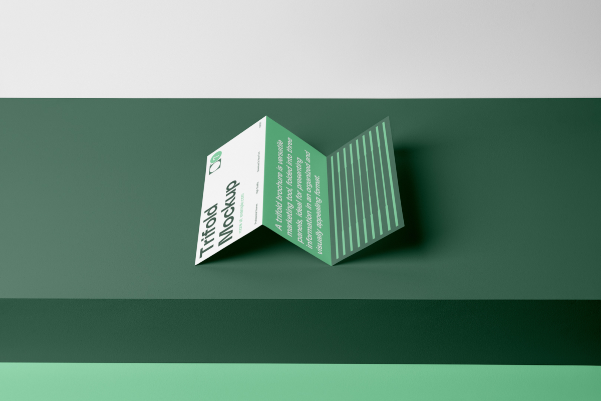 Front view, Trifold Mockup arranged in the letter z laying on a dark green box.