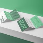 View from above, at a 45-degree angle of two Trifold Mockups arranged in the letter z and laying on a white box.