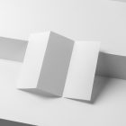 View from above, at a 45-degree angle of white Trifold Mockup based on two boxes with two shades of the white color.