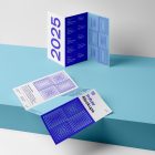 View from above, at a 45-degree angle of two Trifold Mockups. One is laying on the baby blue box. Second is standing on the baby blue box.