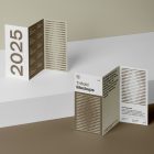 View from above, at a 45-degree angle of two standing Trifold Mockups arranged in the letter z. One is standing on the white box. Second is standing on a brown box.