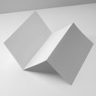 View from above, at a 45-degree angle of white Trifold Mockup arranged in the letter z and laying on a white box.