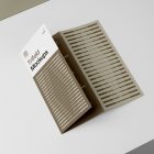 View from above, at a 45-degree angle of Trifold Mockup arranged in the letter z laying on a white box.
