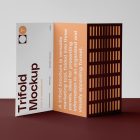 Front view, of a single Trifold Mockup arranged in the letter z standing on a claret floor. Behind the Trifold Mockup is a huge white wall.