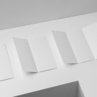 View from above, at a 45-degree angle of a three white Trifold Mockups laying on a white box.