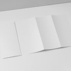 View from above, at a 45-degree angle of a two white Trifold Mockups laying on a white box.