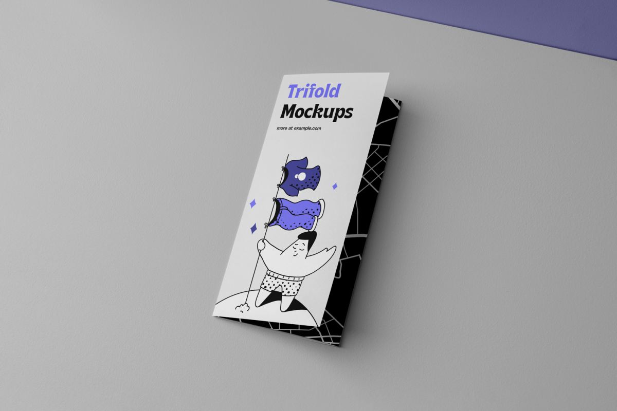 View from above, at a 45-degree angle of a single Trifold Mockup laying on a light gray box.