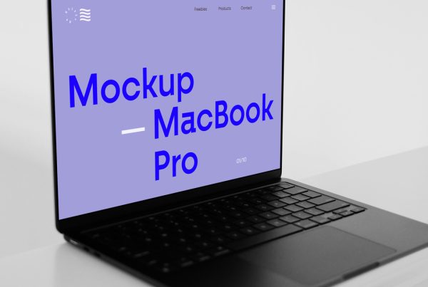 Open black MacBook Pro Mockup standing on the white floor.