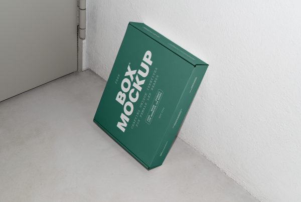 View from above of a green box mockup with white strong typography design based on white wall.