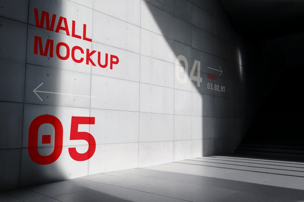 Big concrete wall mockup in perspective with red and white typography design.
